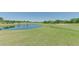 Golf course with pond and green at 236 Golden Harbour Trl, Bradenton, FL 34212
