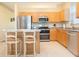 Kitchen with stainless steel appliances and wood cabinets at 236 Golden Harbour Trl, Bradenton, FL 34212