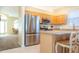 Modern kitchen with stainless steel appliances and light wood cabinets at 236 Golden Harbour Trl, Bradenton, FL 34212