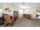 Cozy living room with rocking chair and dining area at 236 Golden Harbour Trl, Bradenton, FL 34212