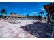 Spacious pool deck with lounge chairs and pergola at 236 Golden Harbour Trl, Bradenton, FL 34212