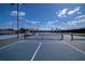 Well-maintained tennis courts in a sunny outdoor setting at 236 Golden Harbour Trl, Bradenton, FL 34212
