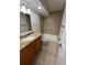 Bathroom with granite vanity and shower/tub combo at 2630 Coconut Bay Ln # 6111, Sarasota, FL 34237