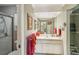 Clean bathroom with updated vanity, large mirror, and walk-in shower at 3001 Seawind Cir # 10C, Venice, FL 34293