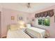 Twin bedroom with light walls and two beds, perfect for guests at 3001 Seawind Cir # 10C, Venice, FL 34293