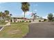 Community building with parking and flagpole at 3001 Seawind Cir # 10C, Venice, FL 34293