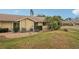 Side exterior view of the house and landscaping at 3001 Seawind Cir # 10C, Venice, FL 34293