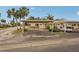 Exterior view showing carport and landscaping at 3001 Seawind Cir # 10C, Venice, FL 34293