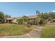 Back exterior view with patio and landscaping at 3001 Seawind Cir # 10C, Venice, FL 34293