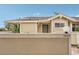 Exterior view of condo with light yellow walls and a small patio at 3001 Seawind Cir # 10C, Venice, FL 34293