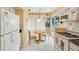 Cozy kitchen with breakfast nook, updated appliances, and access to patio at 3001 Seawind Cir # 10C, Venice, FL 34293