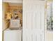 Laundry room with washer, dryer, and shelving at 3001 Seawind Cir # 10C, Venice, FL 34293