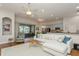 Spacious living room with L-shaped sofa and view of the pool at 318 Star Shell Dr, Apollo Beach, FL 33572