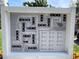 Village Brooke Condominium community map showing building numbers, tennis court, and pool at 3231 Beneva Rd # 103, Sarasota, FL 34232