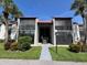 Condo building exterior featuring a walkway and landscaping at 3231 Beneva Rd # 103, Sarasota, FL 34232