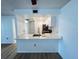 Modern kitchen with white cabinets and stainless steel appliances at 3231 Beneva Rd # 103, Sarasota, FL 34232
