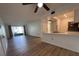 Bright living room with vinyl flooring and kitchen bar at 3231 Beneva Rd # 103, Sarasota, FL 34232