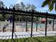 Relaxing pool area with pergola and patio furniture at 3231 Beneva Rd # 103, Sarasota, FL 34232