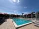 Community swimming pool with plenty of lounge chairs at 3231 Beneva Rd # 103, Sarasota, FL 34232