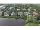 Wide aerial view of a luxury home on the waterfront, nestled in a community at 3310 Sabal Cove Ln, Longboat Key, FL 34228