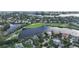 Waterfront property with lush landscaping and golf course views at 3310 Sabal Cove Ln, Longboat Key, FL 34228