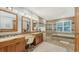 Luxurious bathroom with double vanity, soaking tub, and walk-in shower at 3310 Sabal Cove Ln, Longboat Key, FL 34228