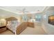 Bedroom with wicker bed frame and ocean themed decor at 3310 Sabal Cove Ln, Longboat Key, FL 34228