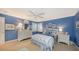 Blue bedroom with double bed, white dresser, and window shutters at 3310 Sabal Cove Ln, Longboat Key, FL 34228