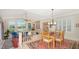 Cozy dining area with a view of the water and access to the living room at 3310 Sabal Cove Ln, Longboat Key, FL 34228