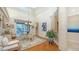 Elegant dining room with hardwood floors and a view to the backyard at 3310 Sabal Cove Ln, Longboat Key, FL 34228