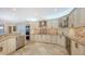 Gourmet kitchen features granite counters, stainless steel appliances, and a breakfast bar at 3310 Sabal Cove Ln, Longboat Key, FL 34228