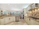 Large kitchen with granite countertops, stainless steel appliances, and an island at 3310 Sabal Cove Ln, Longboat Key, FL 34228