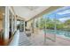 Screened lanai with pool and patio furniture at 3310 Sabal Cove Ln, Longboat Key, FL 34228