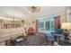 Comfortable living room with pool view and access to patio at 3310 Sabal Cove Ln, Longboat Key, FL 34228