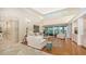 Spacious living room with hardwood floors, high ceilings and access to a relaxing patio at 3310 Sabal Cove Ln, Longboat Key, FL 34228