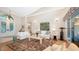 Spacious living room with hardwood floors, high ceilings, and comfortable seating area at 3310 Sabal Cove Ln, Longboat Key, FL 34228