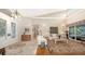 Bright and airy living room with hardwood floors, high ceilings, and a comfy seating area at 3310 Sabal Cove Ln, Longboat Key, FL 34228