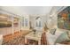 Spacious living room with hardwood floors, built-in shelving, and large windows at 3310 Sabal Cove Ln, Longboat Key, FL 34228
