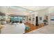 Bright living room featuring hardwood floors, high ceilings, and a view to the backyard at 3310 Sabal Cove Ln, Longboat Key, FL 34228