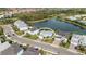 Aerial view of a house nestled in a community with a lake at 3431 Chestertown Loop, Bradenton, FL 34211