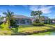 Aerial view showcasing a house's backyard, pool, and lake view at 3431 Chestertown Loop, Bradenton, FL 34211
