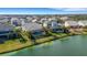 Aerial perspective of houses along the lake, showcasing the community at 3431 Chestertown Loop, Bradenton, FL 34211