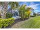 Landscaped backyard with lush greenery and pool view at 3431 Chestertown Loop, Bradenton, FL 34211