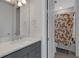 Gray vanity with white countertop and shower/tub combo at 3431 Chestertown Loop, Bradenton, FL 34211