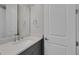 Modern bathroom with gray vanity, quartz countertop, and chrome fixtures at 3431 Chestertown Loop, Bradenton, FL 34211