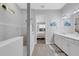 Modern bathroom with double vanity and walk-in shower at 3431 Chestertown Loop, Bradenton, FL 34211