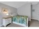 Bedroom with white dresser and a tropical-themed bedspread at 3431 Chestertown Loop, Bradenton, FL 34211