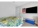Bedroom with a white bed frame, tropical bedding, and a Star Wars poster at 3431 Chestertown Loop, Bradenton, FL 34211