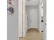 Long hallway with light gray walls and wood-look flooring at 3431 Chestertown Loop, Bradenton, FL 34211