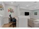 Bright home office with a built-in desk and view of the living room at 3431 Chestertown Loop, Bradenton, FL 34211